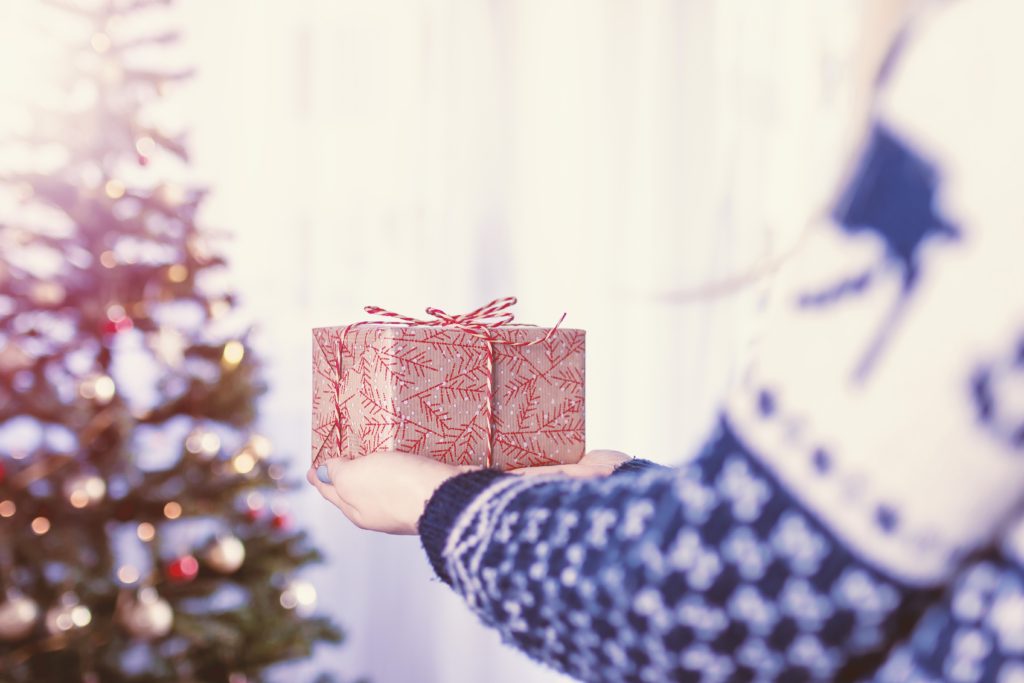 girl handing present