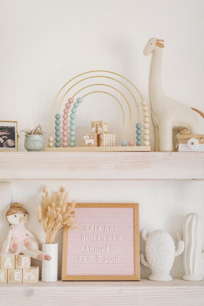styled floating shelves in a nursery