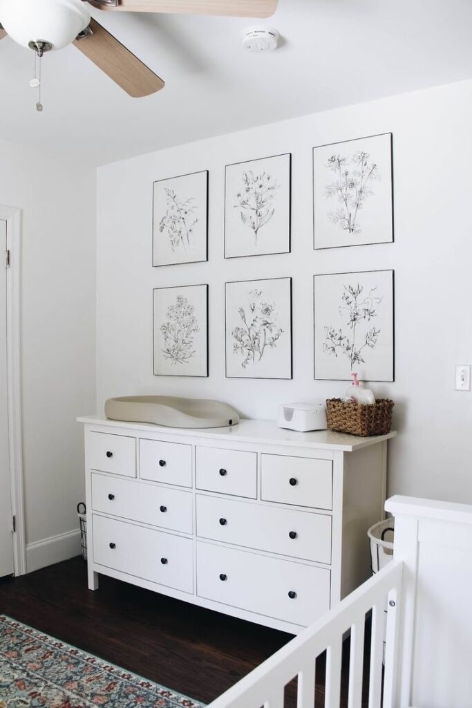 gallery wall above changing table in nursery