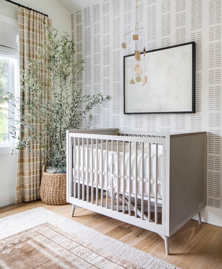 baby nursery with wallpaper