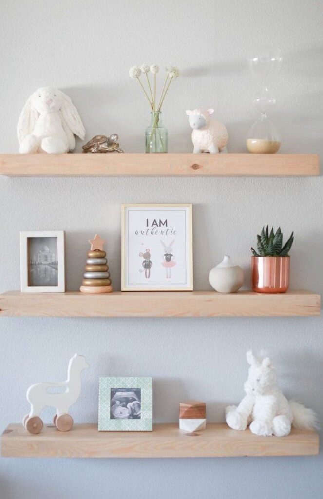 styled floating shelves in a nursery