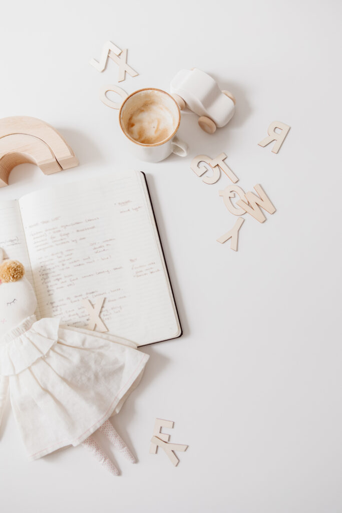 baby toys, coffee, and a journal